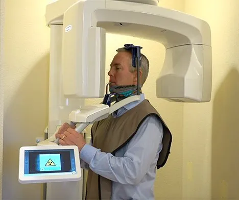 man standing in cbct scanner