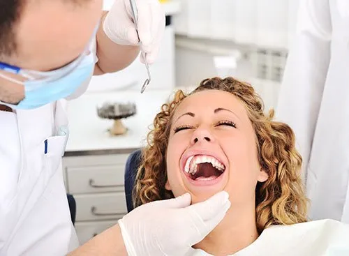 laughing woman in dental chair